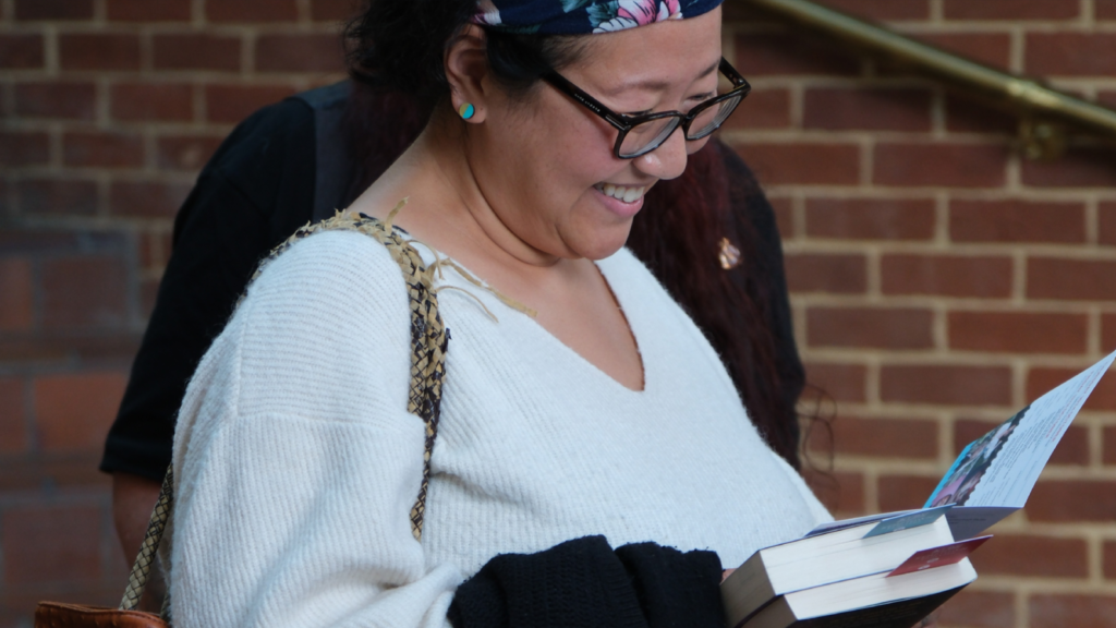 Looking at a book with joy