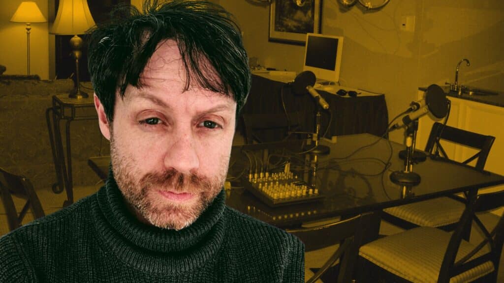 Neil Noon with podcasting equipment in the background.