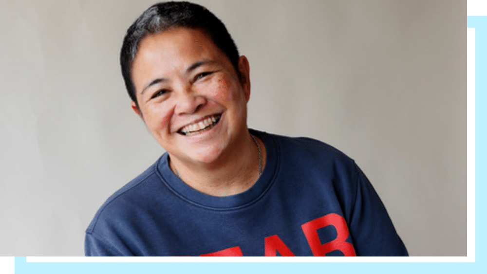 Jackie Mendoza, a middle aged south east Asian woman with short dark hair.