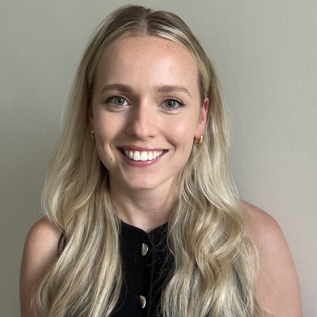 Jess Harvey, a young white woman with long blonde hair and a black top